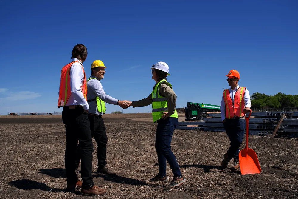A handshake at a solar project