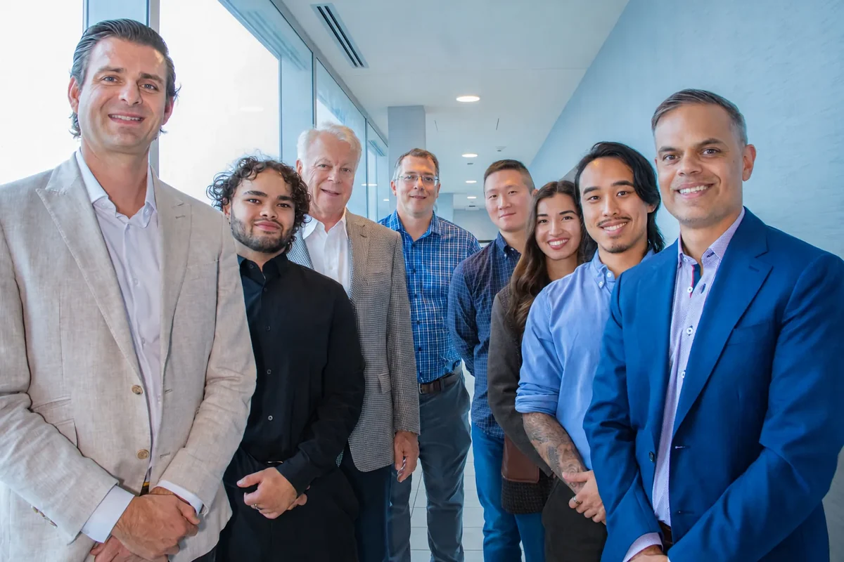 The Enterprise Energy team together in a bright office hallway